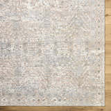 Close-up of the Avalyn Area Rug. Cream, light sage, light slate, and tan farmhouse traditional rug design. Corner