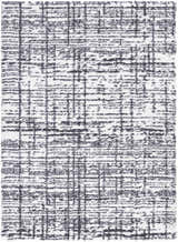 Close-up of the Anisha Black Area Rug showing a contemporary shag design with black and white textured pattern. Design-Rectangle-537