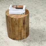 Living room scene with a beige Fetscher II Vintage Medallion Area Rug, wood side table, and books. Styleshot