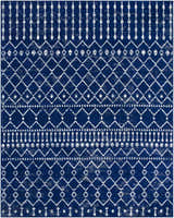 Close-up of the Varun Area Rug, a machine-woven rug with a blue and white bohemian-inspired geometric pattern. Design-Rectangle