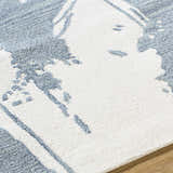 Close up of the Viven Slate Blue Area Rug showing a contemporary blue and white pattern. Texture