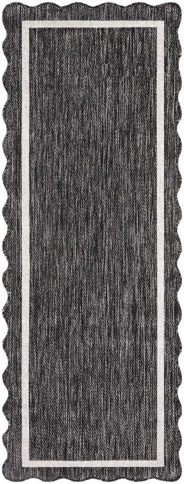 Close-up of the Varro Black Area Rug. Features a black and cream woven design with a scalloped edge and cream border. Design-Runner-2773
