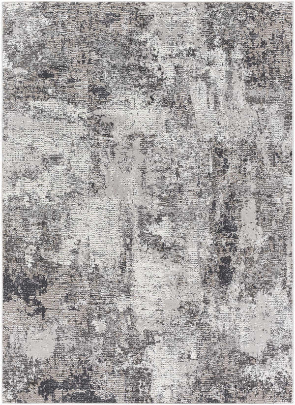 Close-up of the Velez 3D Rock Pattern Washable Rug. Features charcoal, gray, and ivory hues with a textured, contemporary design. Design-Rectangle-4117