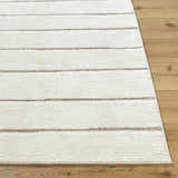 Close-up of the Cascade Machine Woven PNW Home rug. Ivory rug with taupe stripes on a light wood floor. Front