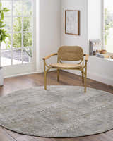 Sunlit home office with a round Owena Thick Luxe Boutique Rug in charcoal, cream, and light brown under a modern chair. Roomscene-Round