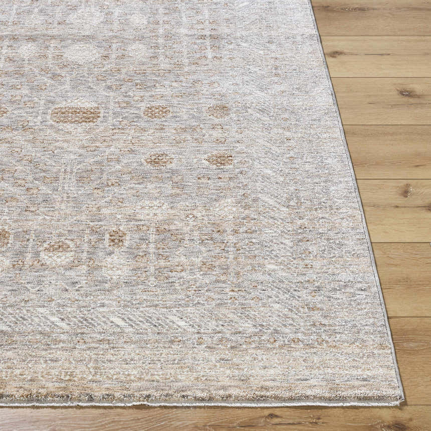 Close-up of Vince Area Rug showing cream, gray, and tan farmhouse design on wood floor. Machine woven polyester rug. Front