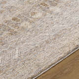 Close-up of the Vince Area Rug showing cream, tan, and gray tones with a subtle traditional pattern. Texture