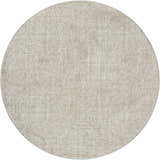 Close-up of the round Dalyn Luxury Voyage VY1 Beige Washable Area Rug, showing its woven texture and neutral color.