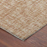 Close-up of the caramel-colored Dalyn Luxury Voyage VY1 Copper Washable Area Rug showing its woven texture.