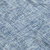 Close-up of the Dalyn Luxury Voyage VY1 Denim Washable Area Rug, showing its woven texture and denim blue color.