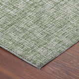 Close-up of the green Dalyn Luxury Voyage VY1 Fern Washable Area Rug showing woven texture and color variation.