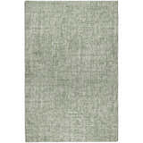 Close-up of the green Dalyn Luxury Voyage VY1 Fern Washable Area Rug, showing its woven texture.