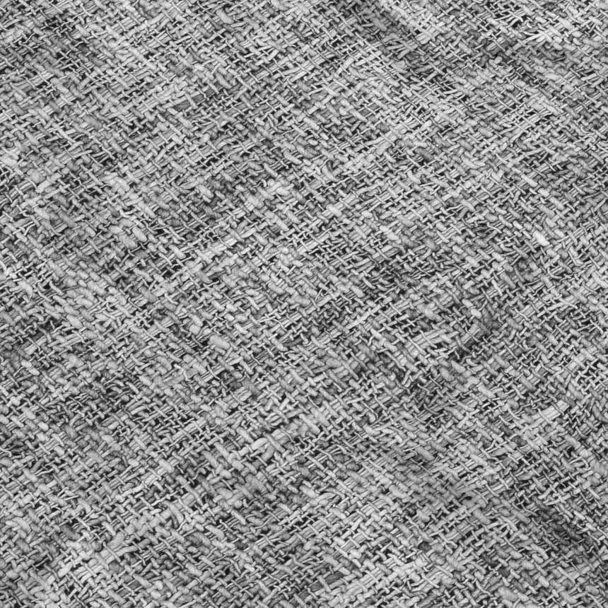 Close-up of the textured weave on the Dalyn Luxury Voyage VY1 Gray Washable Area Rug. Taupe color.