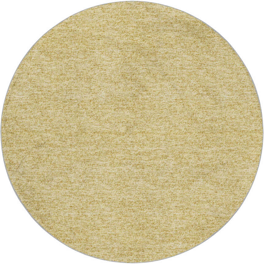 Close-up of a round Dalyn Luxury Voyage VY2 Wheat Washable Area Rug. Peach color and subtle texture.