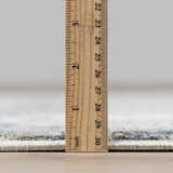 Close-up of Whyalla Misty Thick Luxe Rug pile height, showing its plush, dense texture with a ruler. Pile