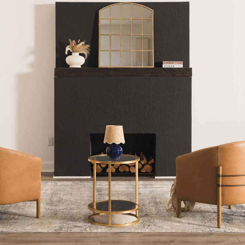 Living room scene with tan chairs, gold accents, and a Whyalla Misty Thick Luxe Rug in dusty sage and light gray. Styleshot