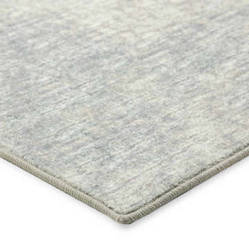 Close-up of the Dalyn Winslow WL1 Ivory Area Rug showing its subtle beige, gray, and ivory pattern and textured edge.