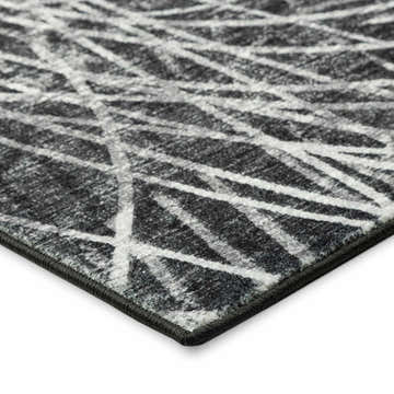 Close-up of the Dalyn Winslow WL2 Midnight Area Rug, showing a black and silver gray geometric pattern and texture.