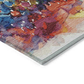 Close-up of the Dalyn Wonderland Navy Washable Area Rug. Abstract design with navy, red, purple, and gold colors.