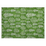 Close-up of Dalyn Wonderland WN21 Green Washable Area Rug. Features a festive white tree branch pattern on a green background.