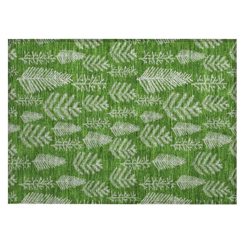 Close-up of Dalyn Wonderland WN21 Green Washable Area Rug. Features a festive white tree branch pattern on a green background.