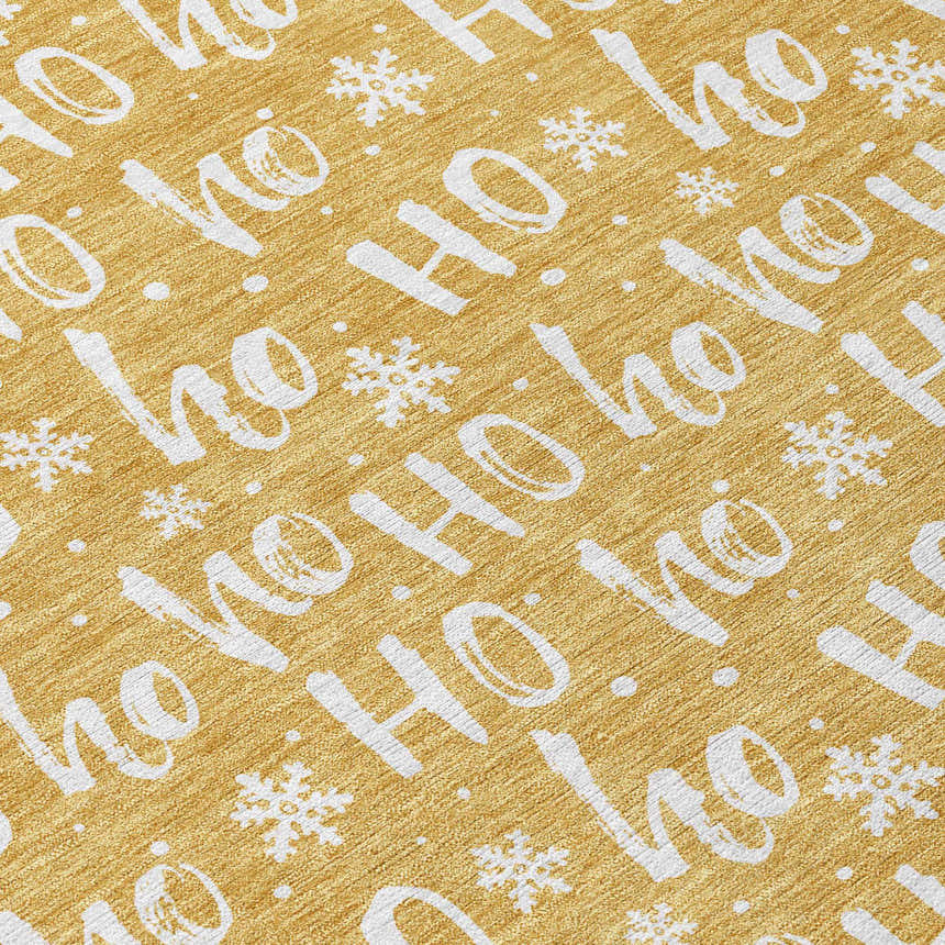 Close-up of Dalyn Wonderland WN22 Gold Washable Area Rug with a festive 