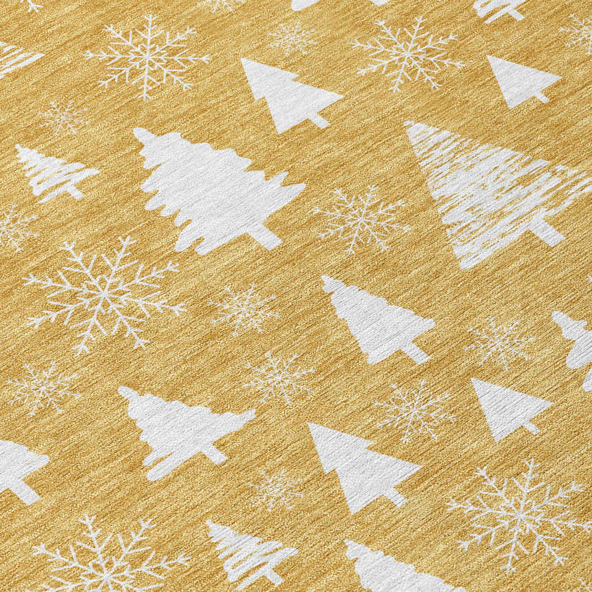 Close-up of Dalyn Wonderland WN23 Gold Washable Area Rug with white snowflakes and Christmas tree pattern. Holiday style.
