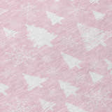 Close-up of Dalyn Wonderland WN23 Pink Washable Area Rug with white Christmas tree and snowflake pattern.