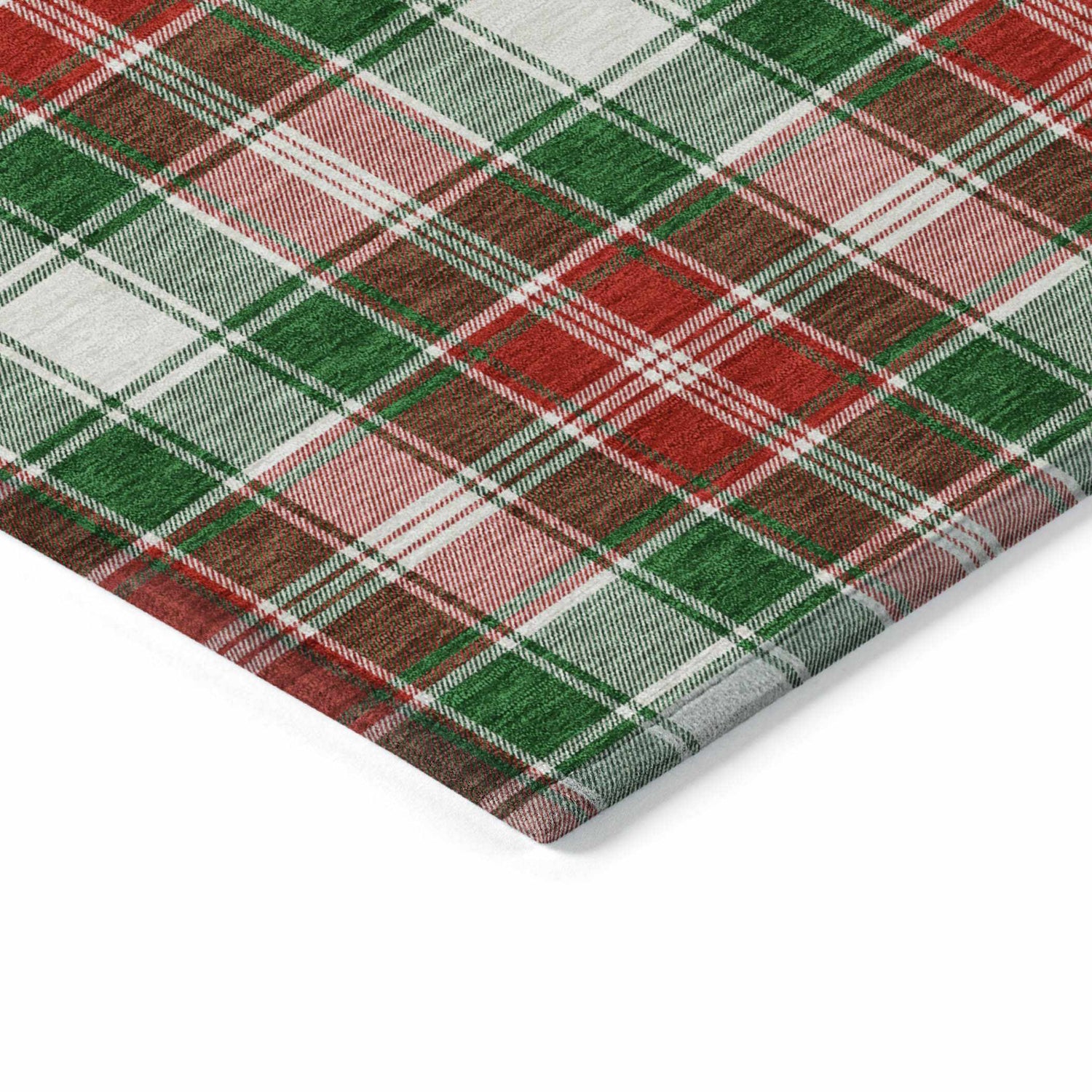 Close up of the Dalyn Wonderland Emerald Washable Area Rug featuring a red, green, and off white plaid pattern.