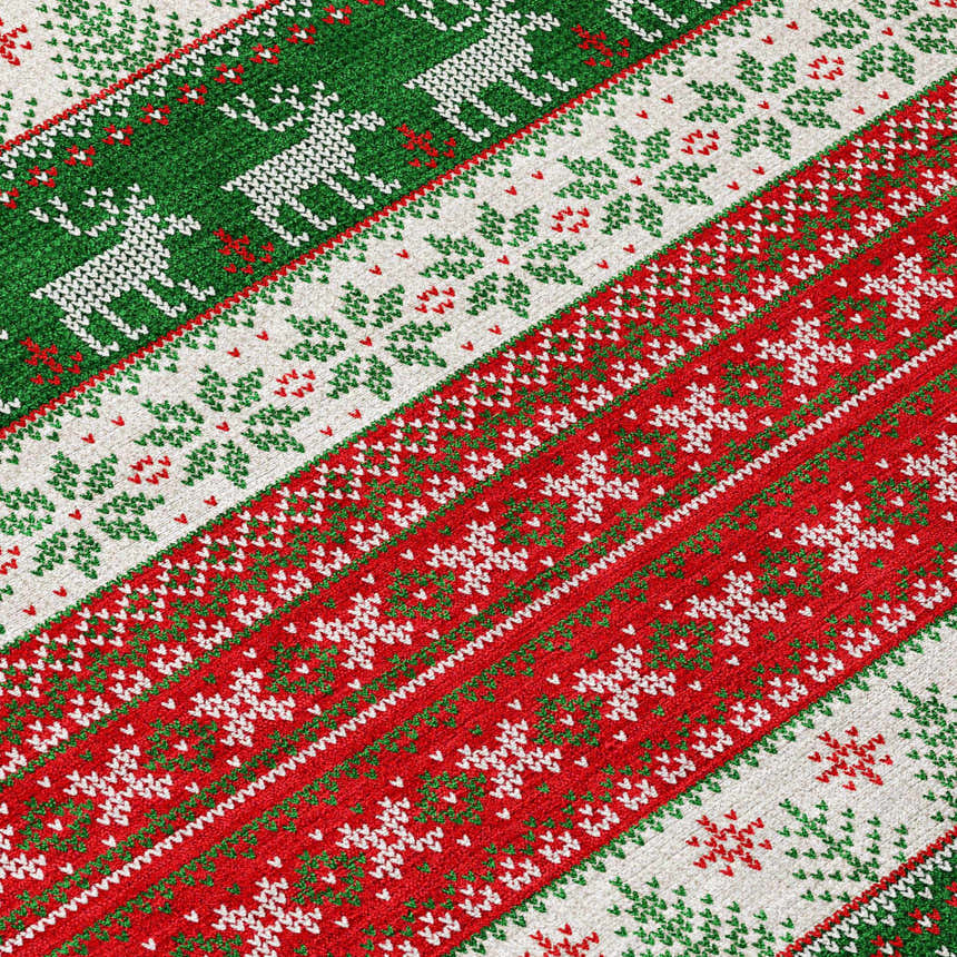 Close-up of Dalyn Wonderland WN26 Red Washable Area Rug. Features a festive red, green, and white holiday pattern.