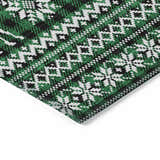 Close-up of the Dalyn Wonderland WN28 Green Washable Area Rug featuring a black, green, and white holiday pattern.