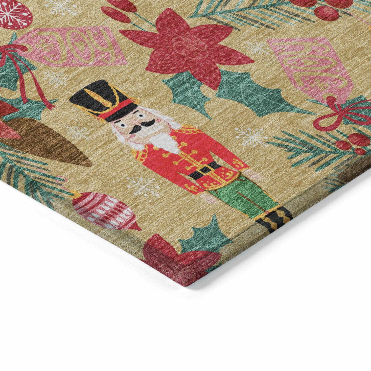 Close-up of Dalyn Wonderland WN30 Gold Washable Area Rug. Holiday design with nutcrackers, ornaments, and holly on gold.