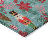 Close-up of Dalyn Wonderland WN30 Teal Washable Area Rug featuring a holiday pattern with nutcrackers and ornaments.