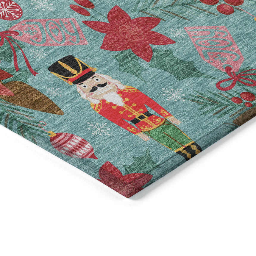 Close-up of Dalyn Wonderland WN30 Teal Washable Area Rug featuring a holiday pattern with nutcrackers and ornaments.