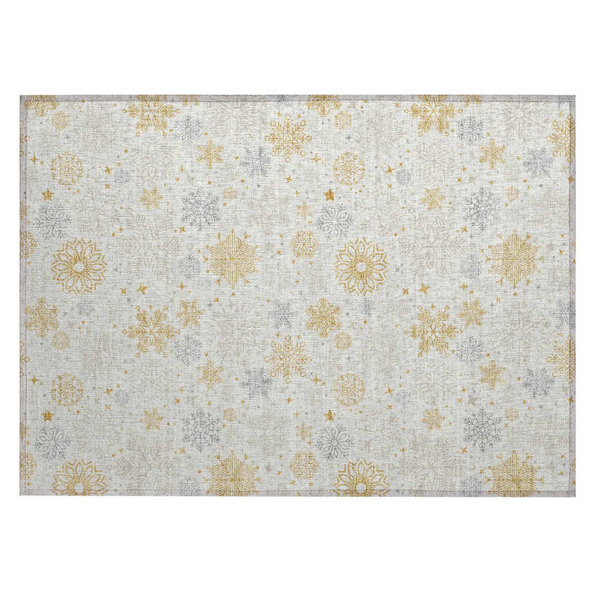 Close-up of Dalyn Wonderland WN31 Ivory Washable Area Rug with gold and taupe snowflake pattern.