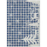 Close-up of Dalyn Wonderland WN32 Blue Washable Area Rug. Features a blue plaid pattern with snowflakes and a white tree design.