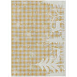 Close-up of the Dalyn Wonderland WN32 Gold Washable Area Rug. Features a gold and taupe checkered pattern with white snowflakes.