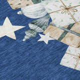 Close-up of Dalyn Wonderland WN33 Navy Washable Area Rug with holiday ornaments, gifts, and white stars.