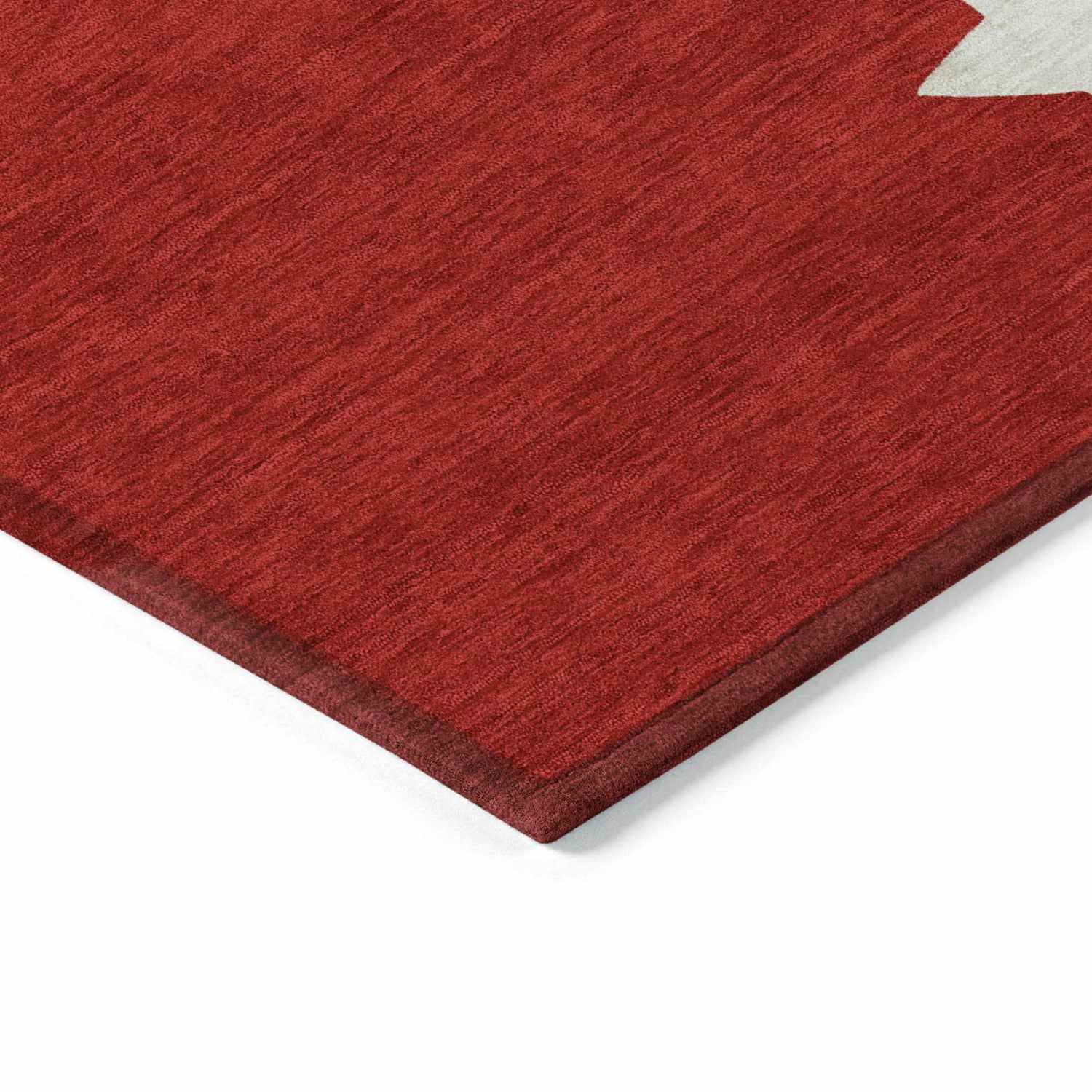 Close-up of the red Dalyn Wonderland WN33 rug, showing the texture and non-skid backing.