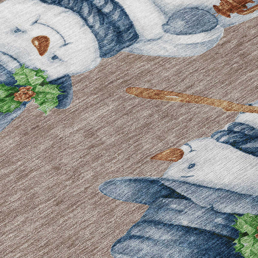 Close-up of the Dalyn Wonderland WN34 Taupe Washable Area Rug featuring a snowman with blue hat and holly design.