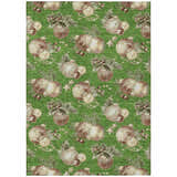 Close-up of Dalyn Wonderland WN36 Green Washable Area Rug. Holiday design with ornaments, stars, and berries.