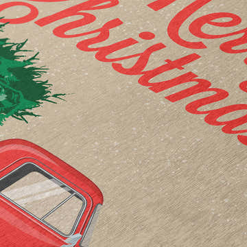 Close up of Dalyn Wonderland Putty rug with red truck, green tree, and Merry Christmas text. Holiday style.