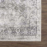 Close-up of the Gray Holi-4607 Washable Area Rug, featuring a traditional vintage design in gray and white on a wood floor. Swatch