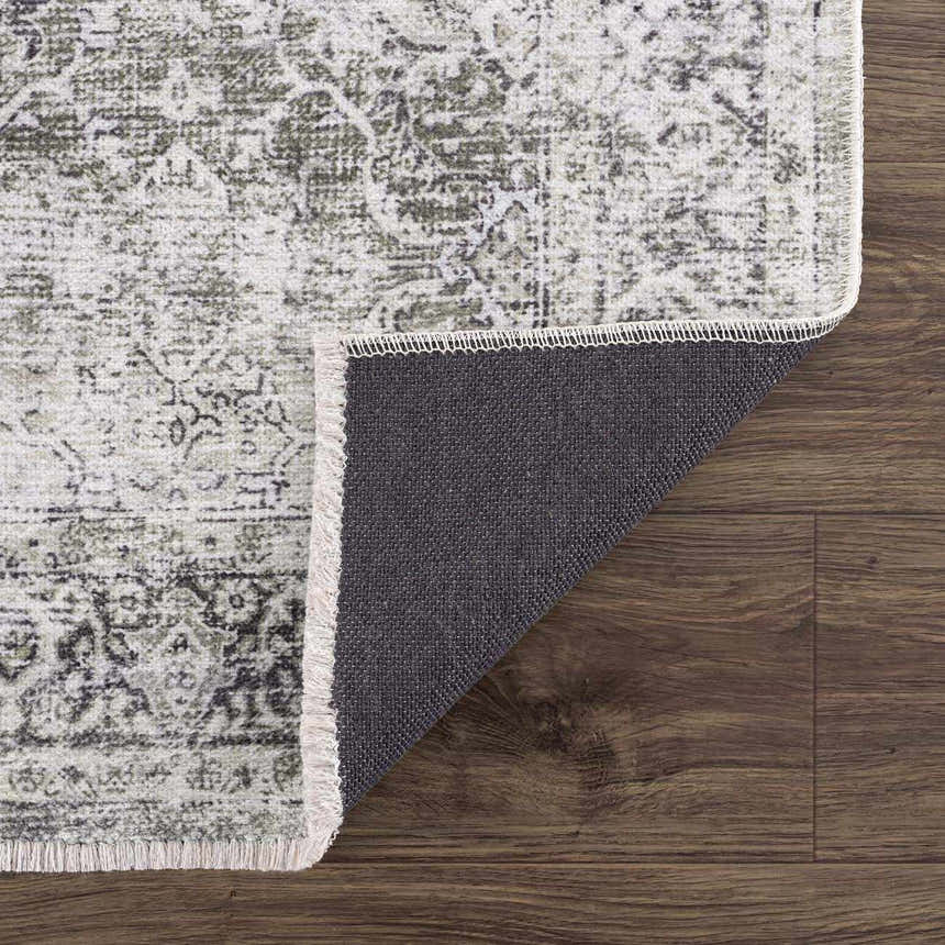 Close-up of Gray Holi-4607 Washable Area Rug showing vintage pattern, fringed edge, and non-slip backing on wood floor. Fold