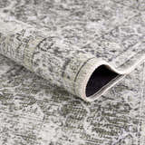 Close-up of the Gray Holi-4607 Washable Area Rug showing its traditional vintage pattern and soft texture. Fold