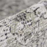 Close-up of the Gray Holi-4607 Washable Area Rug. Features a traditional vintage pattern in gray, white, and subtle green hues. Fold