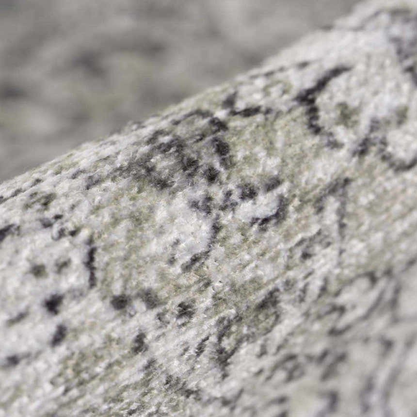 Close-up of the Gray Holi-4607 Washable Area Rug. Features a traditional vintage pattern in gray, white, and subtle green hues. Fold