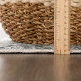 Close-up of the Gray Holi-4607 Washable Area Rug showing its texture, edge, and thickness with a ruler for scale. Pile