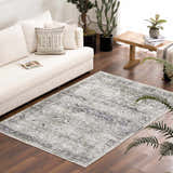 Living room scene with a white sofa and the Gray Holi-4607 Washable Area Rug. The rug has a vintage, traditional pattern in gray and white. Roomscene-Rectangle