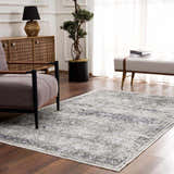 Living room scene with a Gray Holi-4607 Washable Area Rug, armchair, wood cabinet, bench, and wood floors. Roomscene-Rectangle